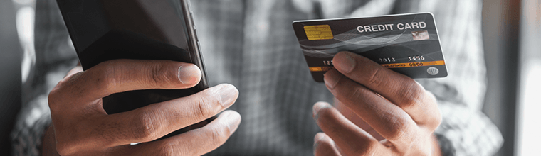 Man using his smartphone to buy a product